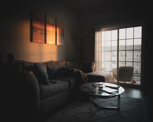 Living room with soft afternoon light coming through blinds